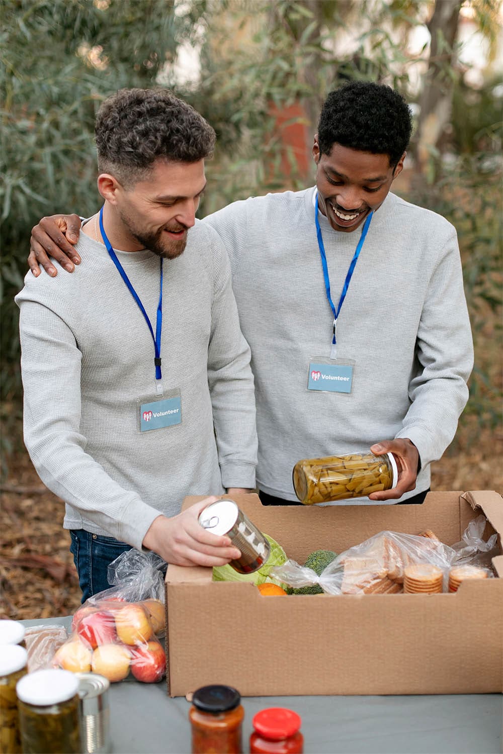 Image shows two people who appear to be working at a food bank.